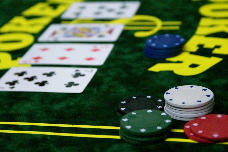 poker table with chips and flop